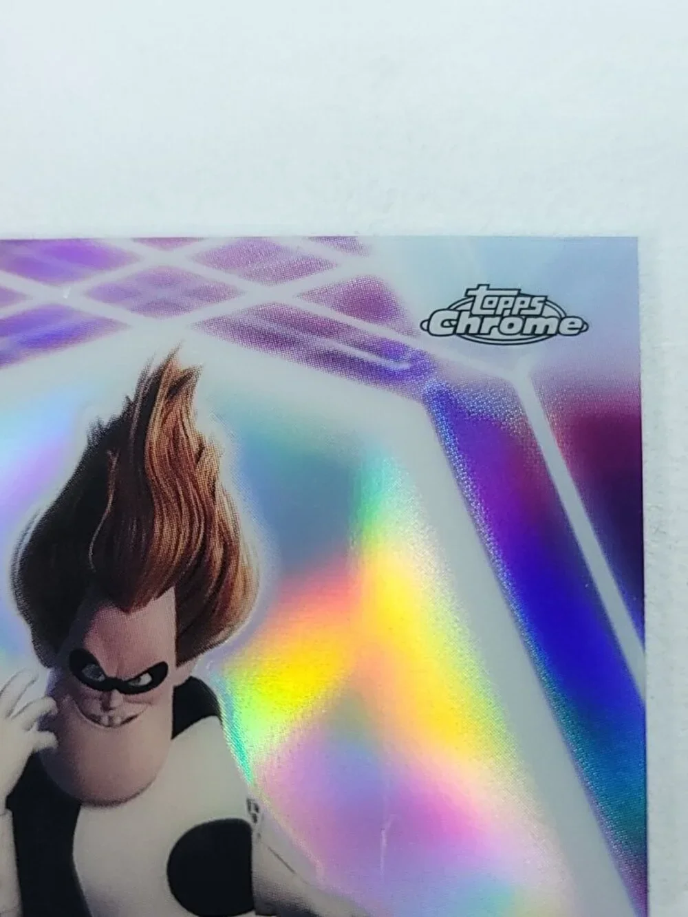 Syndrome Topps 2026 Disney Neon Holo Chrome Limited 070/199 CNE Mark Near Hand